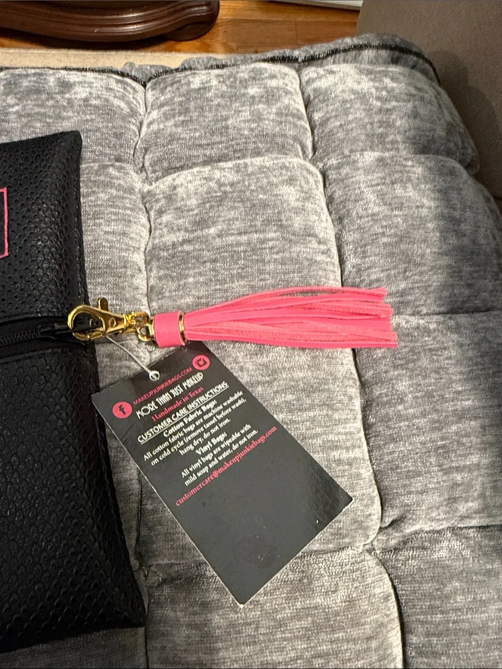 Makeup Junkie Black Cosmetic Bag with Pink Tassel